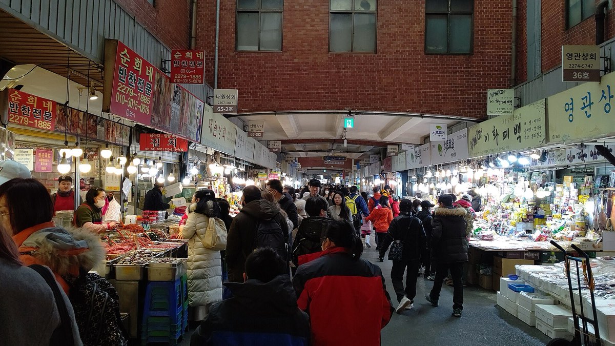 A traditional Seoul market, evoking Squid Game's working-class Ssangmun-dong setting (representative)