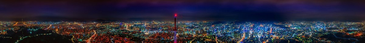 N Seoul Tower lit up at night above Seoul